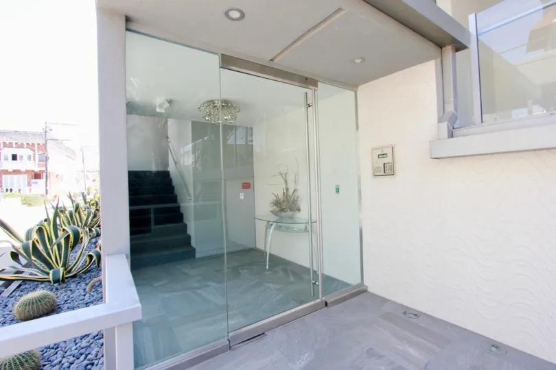 A close look at 4 Jib, a residential building with a clean look and modern garden.