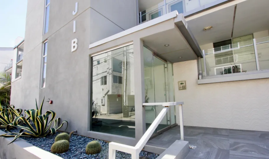 A glass door in a building called jib in 4 jib community