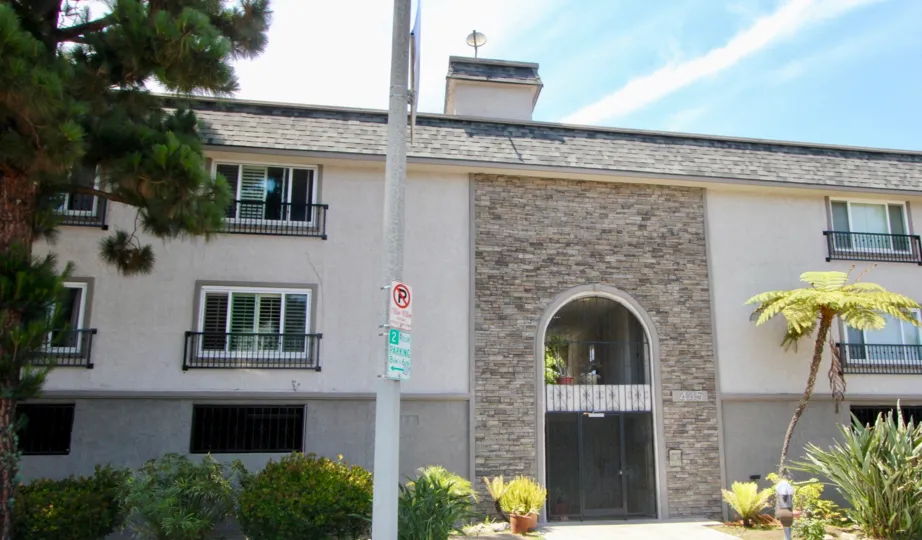 A gated archway and brick facade at Casa Del Rey in Marina Del Rey.