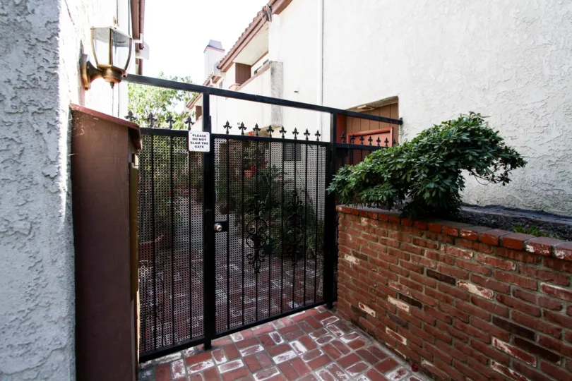 The gated entrance into 11154 Huston St
