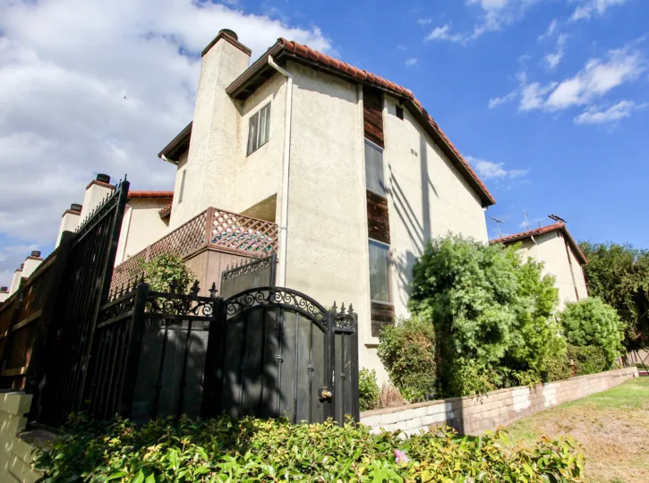 A beautiful house with black gate in nordhoff st at Panorama city