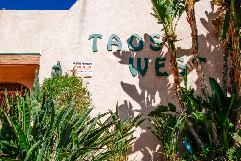 The Taos West name written on the building