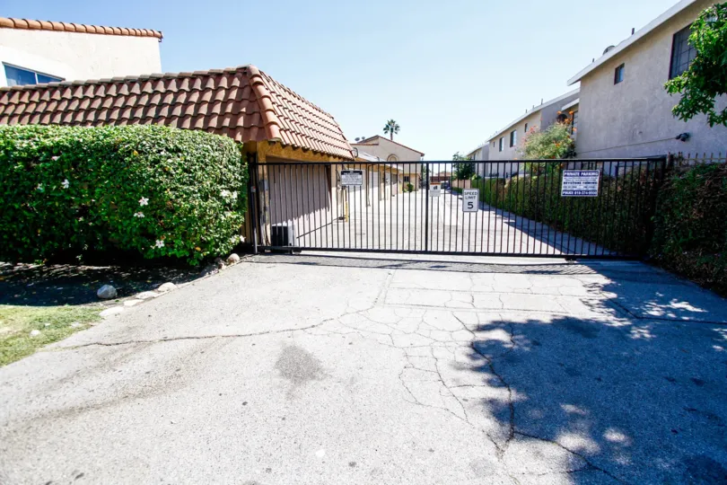 The gate into Woodman Gardens for parking