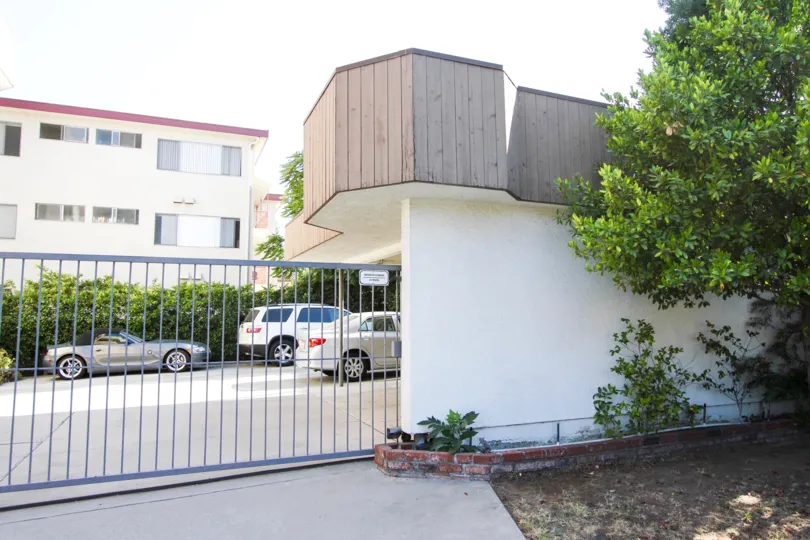 The gate into the parking area at 1080 Cordova St