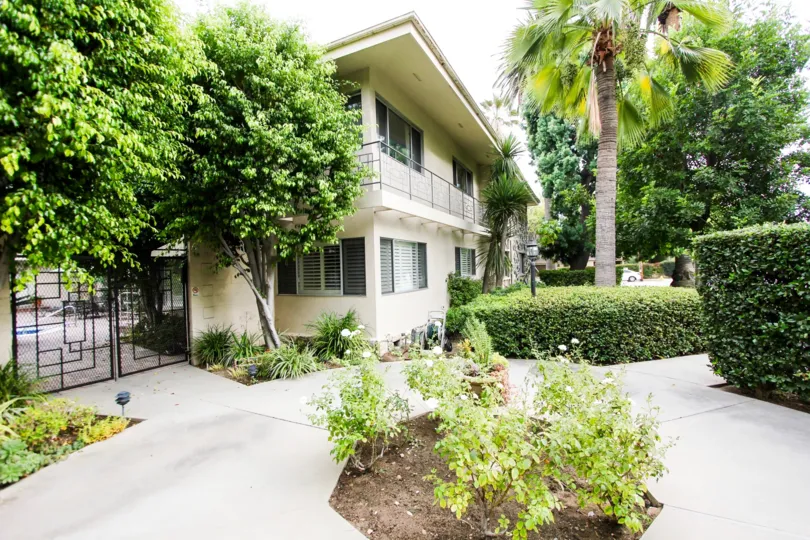 The trees around the building at 1250 S Orange Grove Blvd