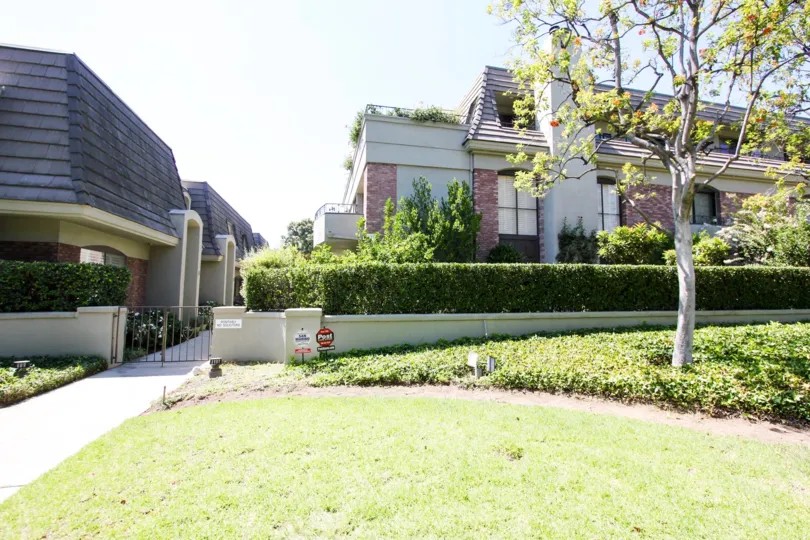 The yard in front of 211 S Orange Grove Blvd