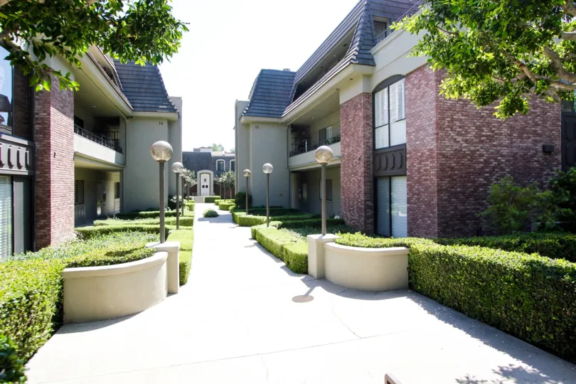 The walkway between the buildings at 211 S Orange Grove Blvd