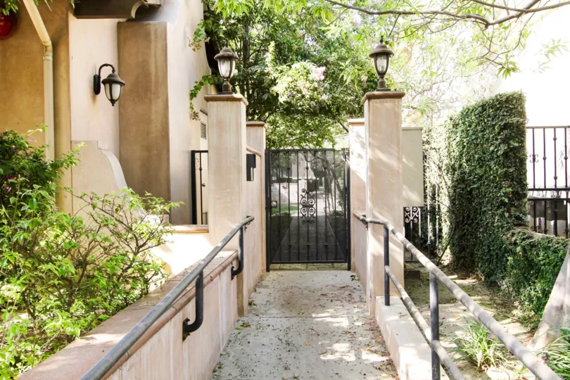 The sidewalk into 2449 Oswego St