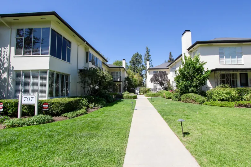 The sidewalk between the buildings at 707 S Orange Grove Blvd