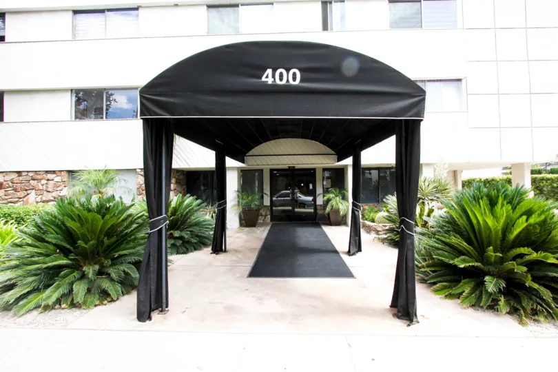 The address for Los Robles Condominiums at the entrance