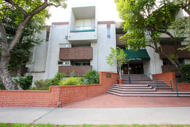 The sidewalk in front of the Los Robles Plaza building