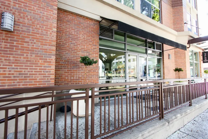 The railing around the entrance into Prado on Lake Avenue