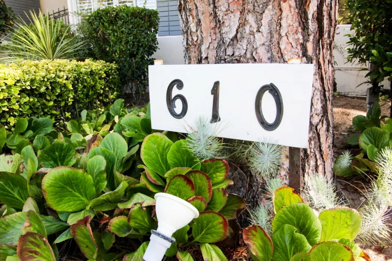 The address plaque for Singing Woods