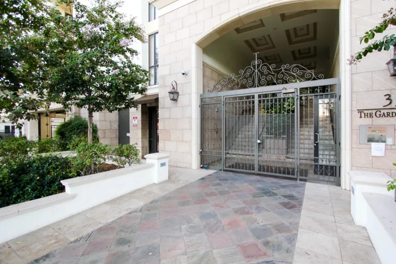 The gated entrance into The Gardens on Hill in Pasadena, California