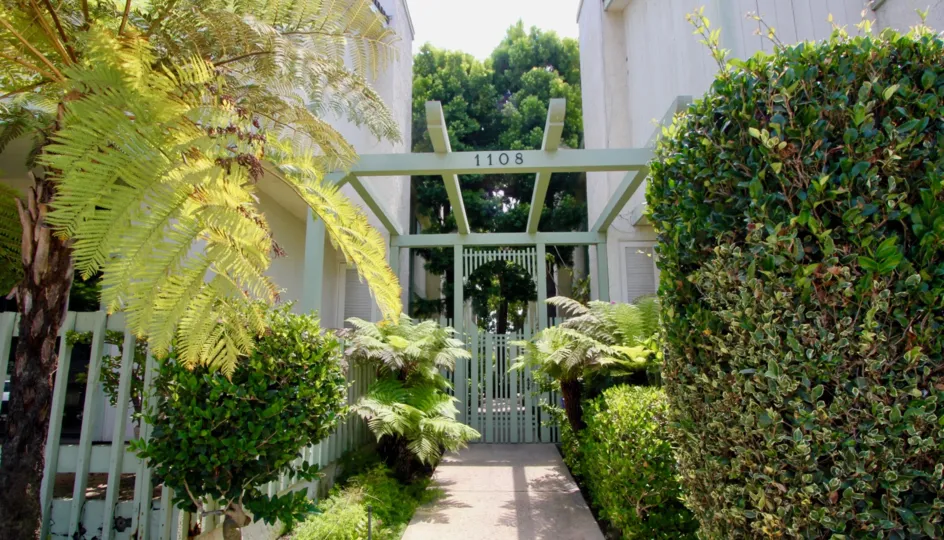 The entry to the building complex at 1108 18th st, Santa Monica California is beautifully constructed with trees planted all around.