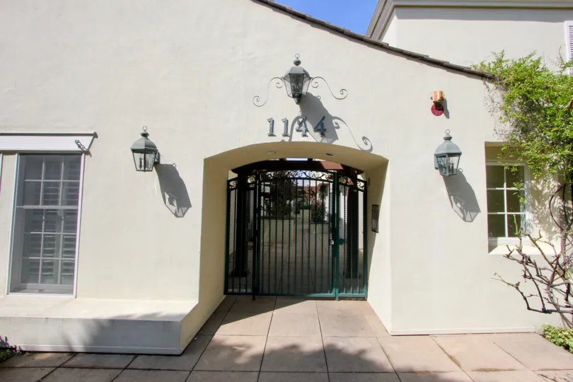 Entrance to 1144 Yale St with lanterns on either side on a sunny day.