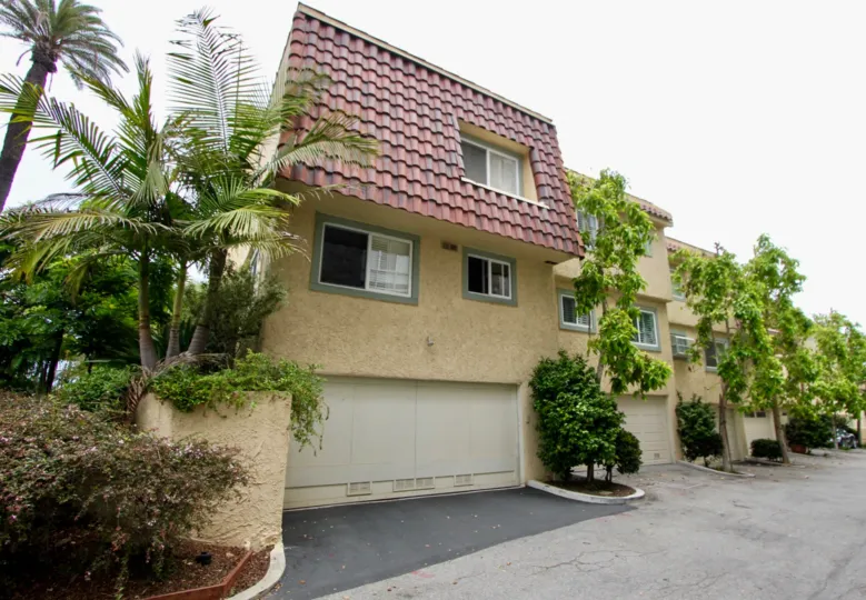 AN entrance of a house in the 130 Marguerita Ave with trees.