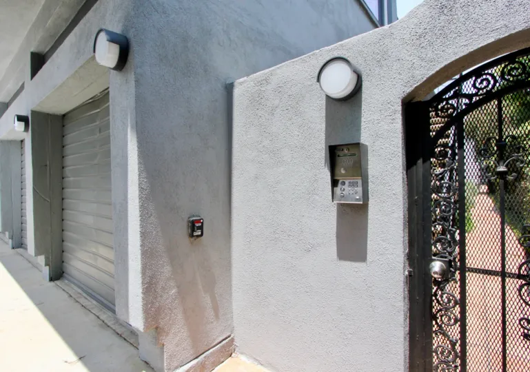 grey house with wrought-iron gates in 1419 15th St