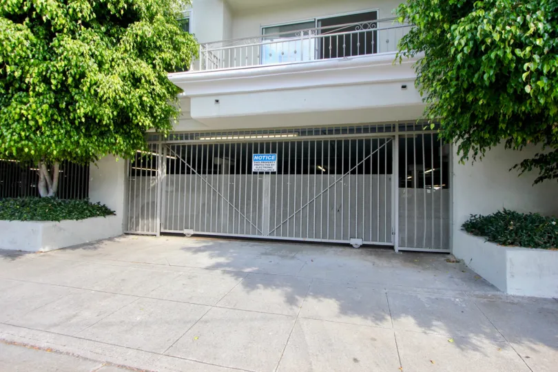 big white building and green trees in 1440 23rd St