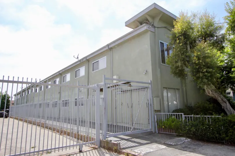 In sunny day the house is looking nice the wall of the house is painted good windows in entrance big gate is present