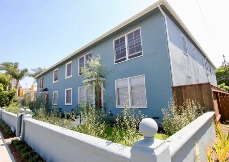 big blue building with garden and plants in 2314 28th St