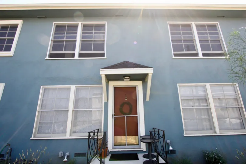 a big blue house in 2314 28th St, with a brown door