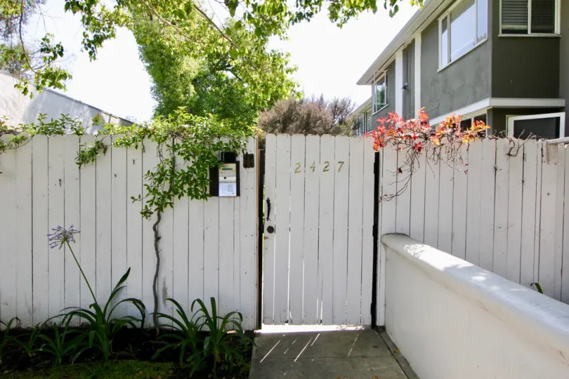 Fence of a villa at the side of a park in 2427 Centinela