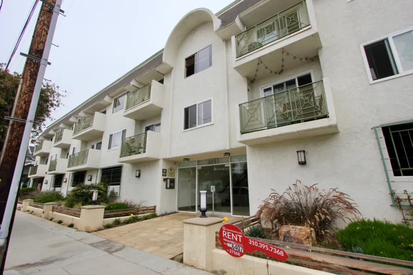 A three-storey housing complex in 2121 2nd St. community with a curved entrance roof.