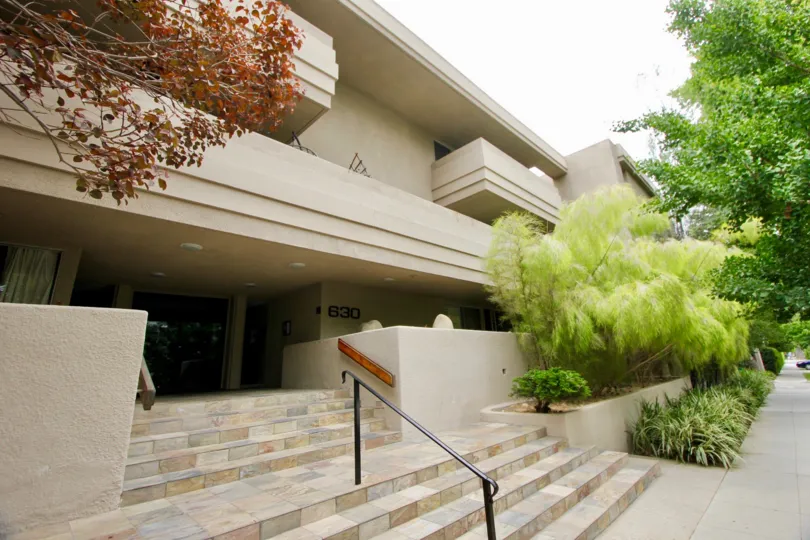 white stairs and a handrail leading up to 630 Idaho in Santa Monica