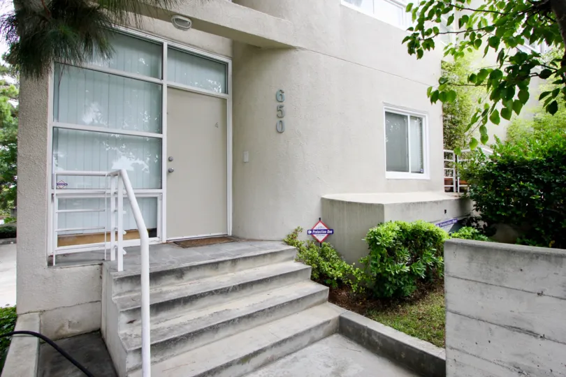 Front door with a small garden beside in the building complex at 650 Pacific Santa Monica, California