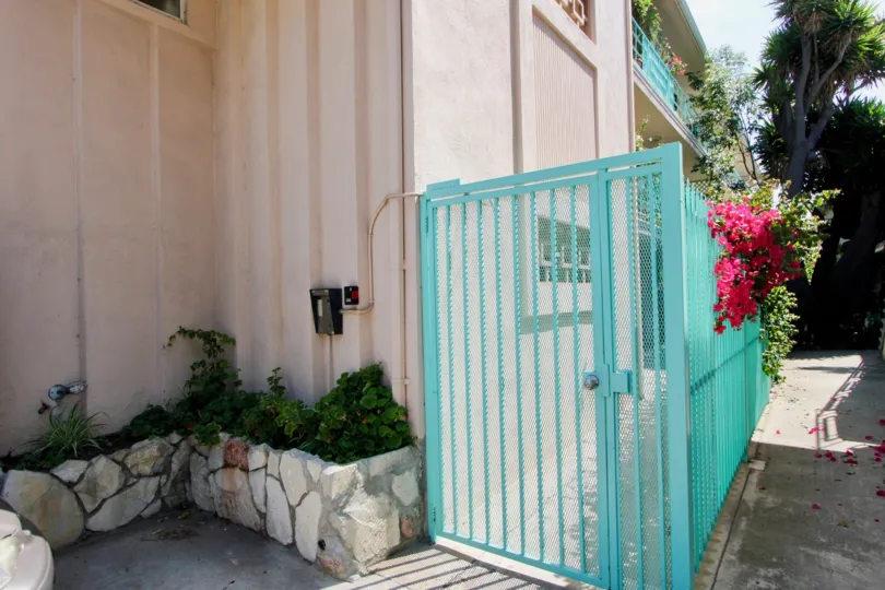 Home in santa monica with light blue grill and section for plants