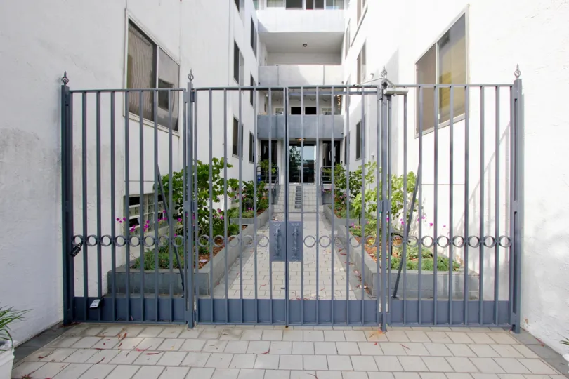closed gate and white walls of 901 10th Street, Santa Monica, California