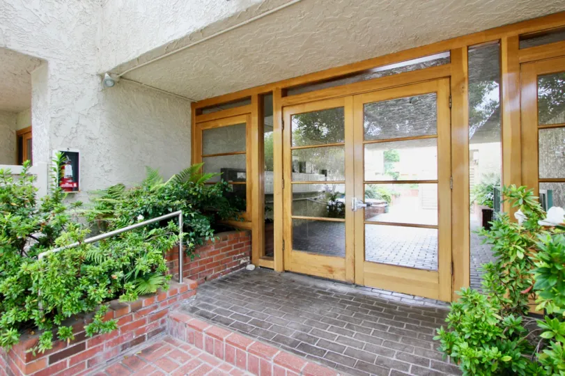 The front entrance of Bay Blue Vista with wide glass doors