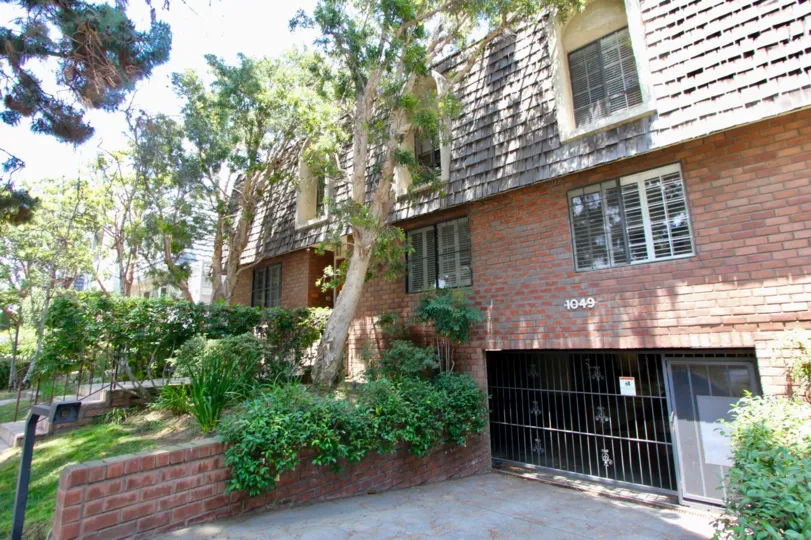 A two-storey apartment in Chateau Regency community with red brick cladding.