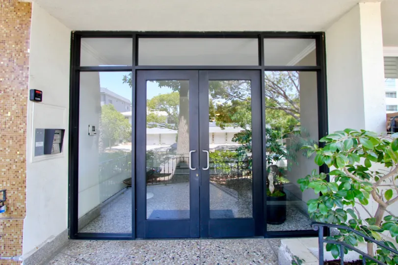 A building in crest manor that should have the modern glass door.