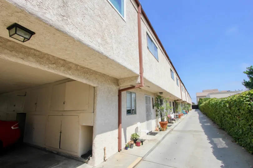 A beautiful day in the Kansas Ave Condominiums with a path.