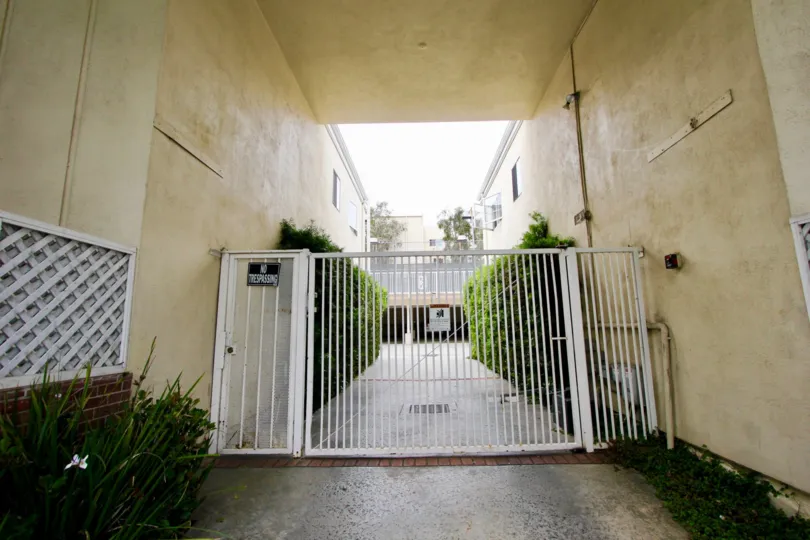 Hedges under a breezeway in a gated complex in La Belle Monique in Santa Monica, California