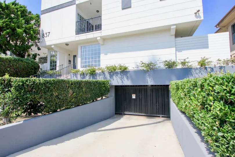 A sunny day in the Lincoln Manor community in Santa Monica, California with trimmed hedges.