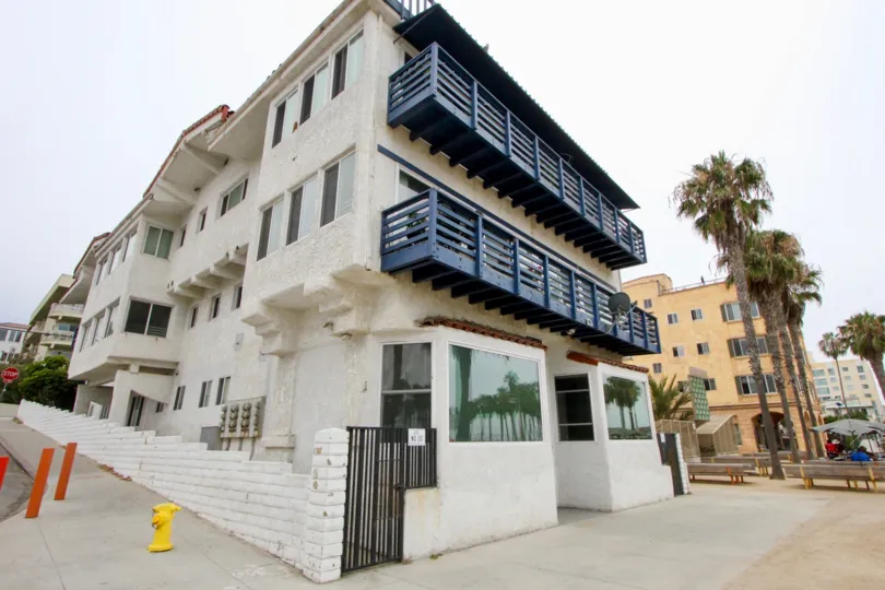 The Ocean View Santa Monica looks tall with many windows in it and with black balcony