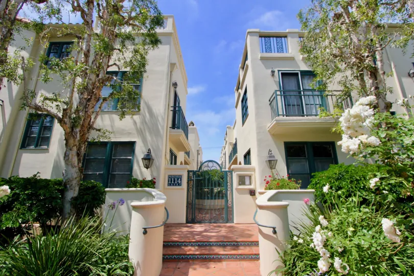 A clear day in the Princeton Court with a gate front of an apartment.
