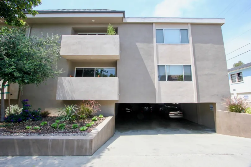 Residential building in Princeton Villa which has two floors a parking garage, and front garden.