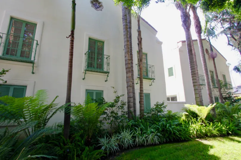 A bright day in the Quintas Malaga with apartments and palm trees.