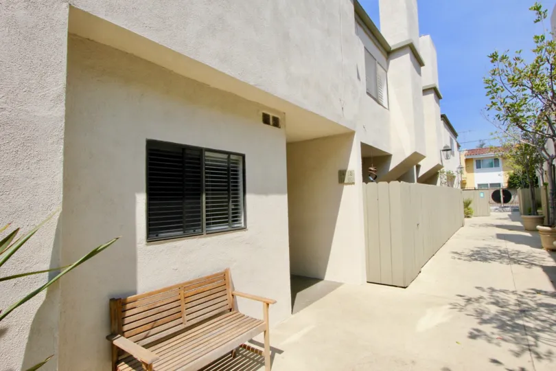 A clear day in the Santa Monica Townhomes with a wooden chair.