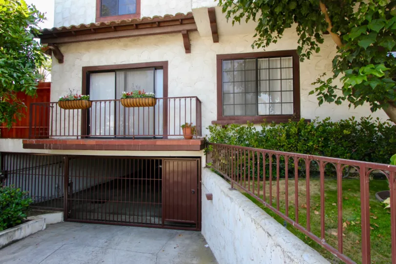The Santa Monica Villas with large glass windows and greenary around