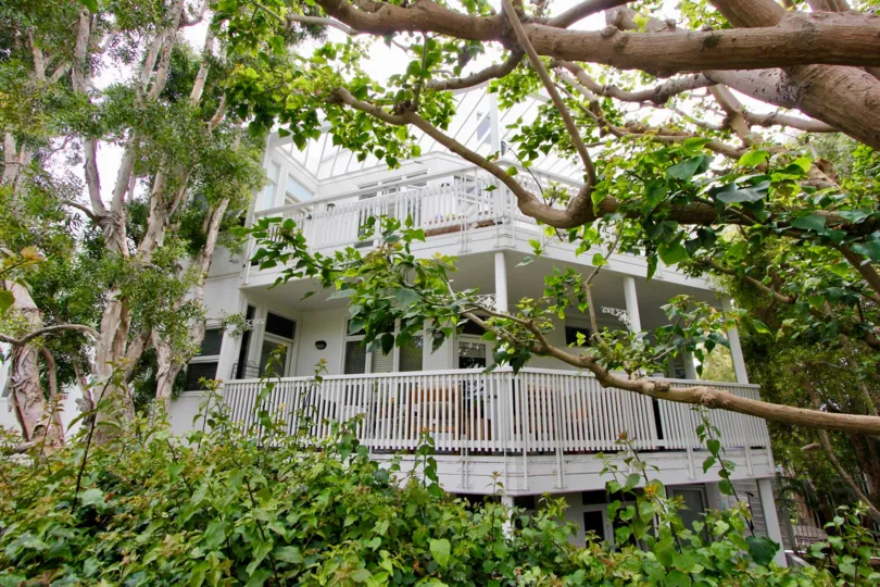 Beautiful trees framing the picturesque tiered porches at Sea View Collection III in Santa Monica, California