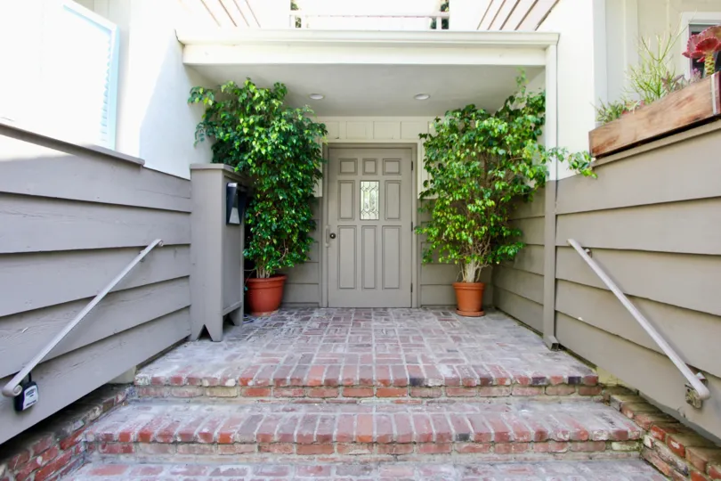 A bright day in the Stanford Street Condos with a apartment front.