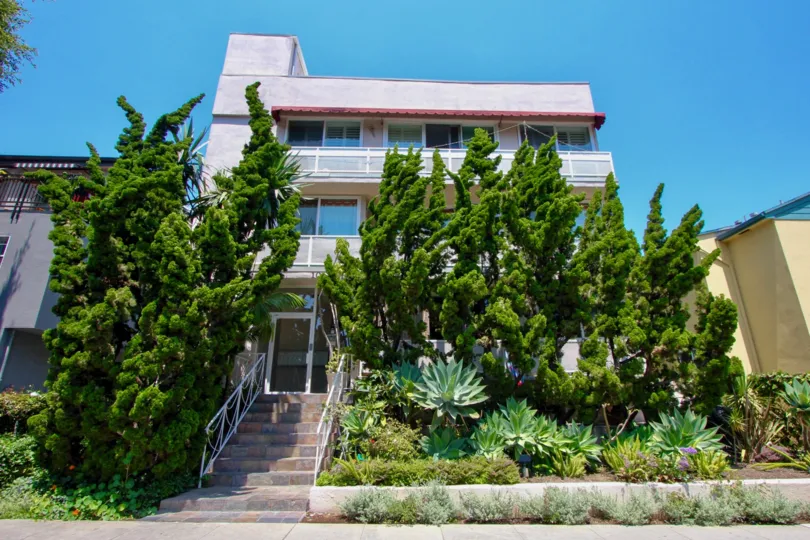 Green trees in front of an apartment building in the Starlight community in Santa Monica, CA