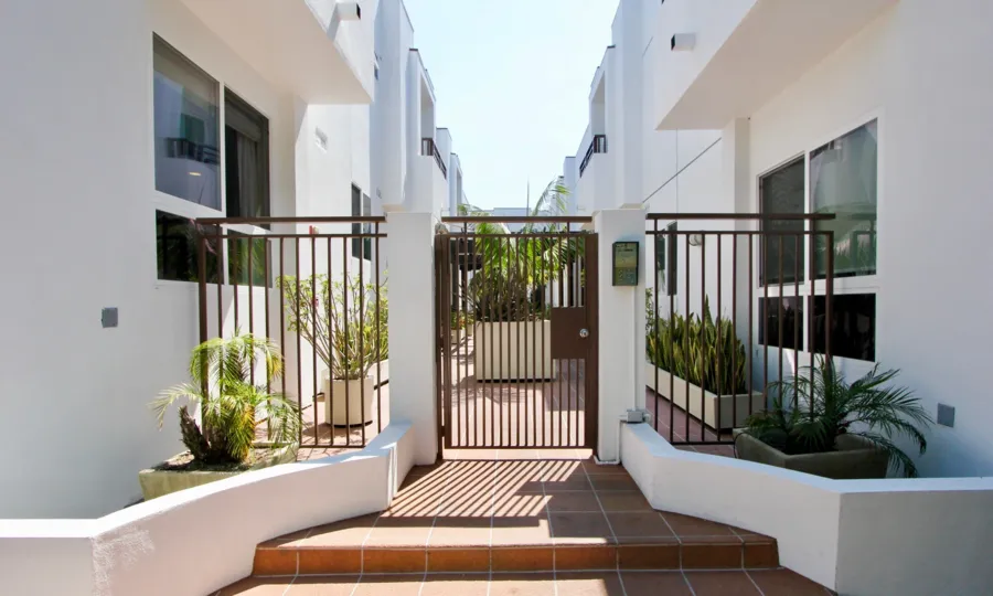 big house of white color and brown metals in California