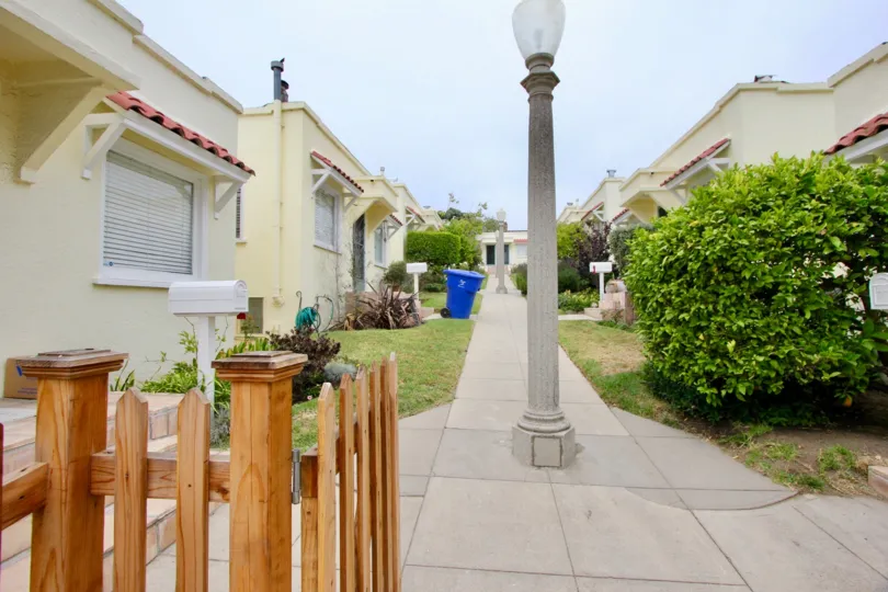 The building is shaped like a squared S. The two extensions extend into a covered patio circling around half the house. The second floor is smaller than the first, which allowed for several small balconies on one side of the house. This floor has roughly 