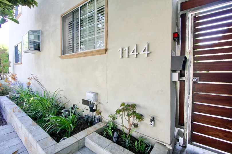 the wooden door entrance to 1144 at the Ten on tenth in Santa Monica